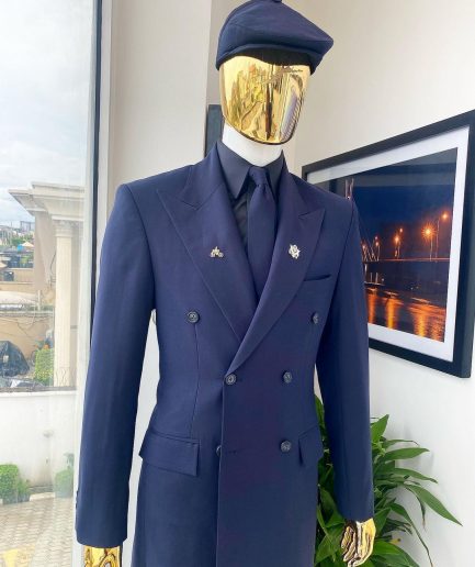 A reloaded monochrome “peaky Blinder” midnight blue peak lapel trench suit