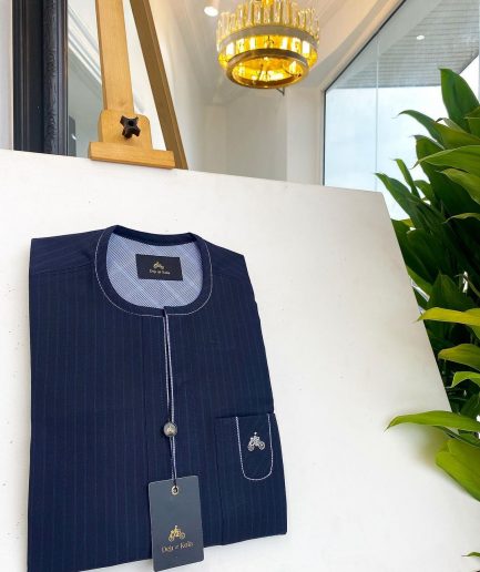 A midnight blue pencil stripe African traditional senator kaftan native.