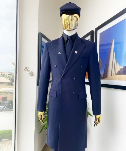 A reloaded monochrome “peaky Blinder” midnight blue peak lapel trench suit