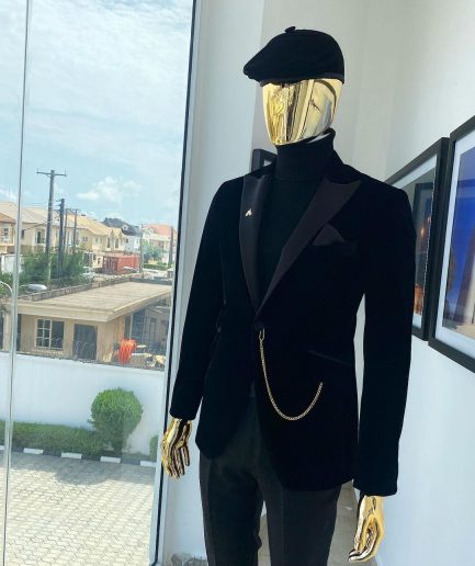 A charcoal black peak lapel-soaked Italian velvet tuxedo suit