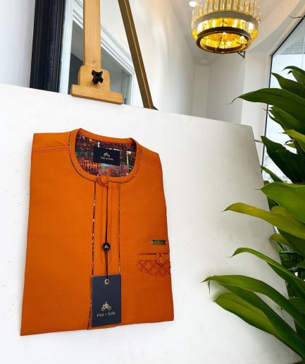 A Fire Orange, covered button, paisley design African traditional senator kaftan native.