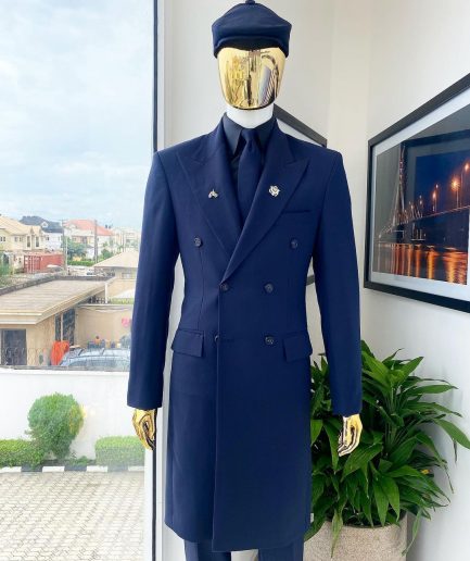 A reloaded monochrome “peaky Blinder” midnight blue peak lapel trench suit