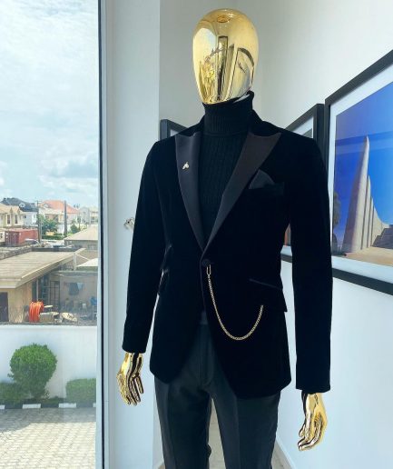 A charcoal black peak lapel soaked Italian velvet tuxedo suit