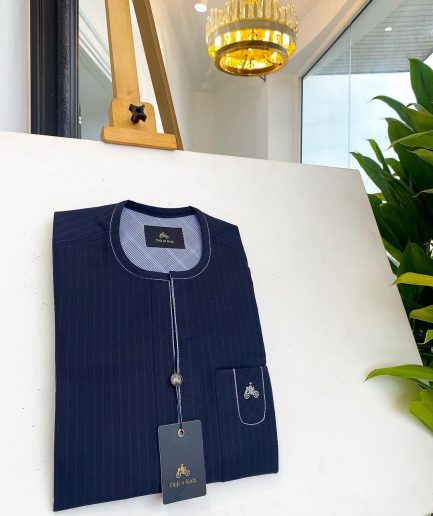 A midnight blue pencil stripe African traditional senator kaftan native.