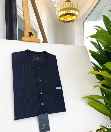 A midnight blue, light blue pencil stripe, clear view Swarovski buttons, horizontal line square embroidery details African traditional senator kaftan native.