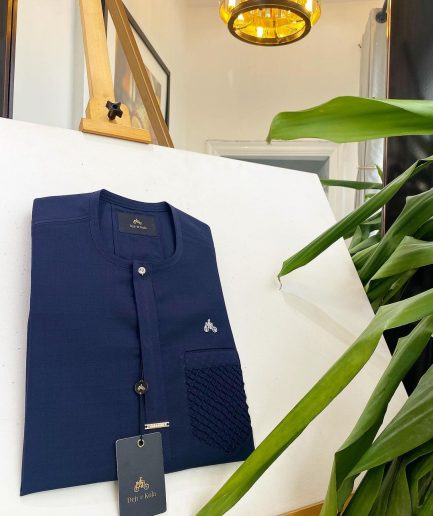 A midnight blue, clear view silver Swarovski buttons and ruffle pocket details African traditional senator kaftan native