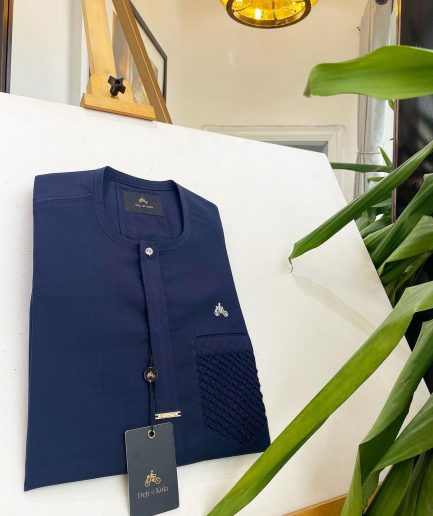 A midnight blue, clear view silver Swarovski buttons and ruffle pocket details African traditional senator kaftan native