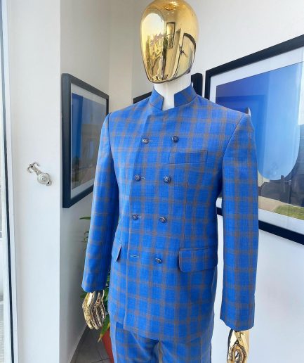 An Azure blue and apricot orange glen check “preacher” double breasted safari suit