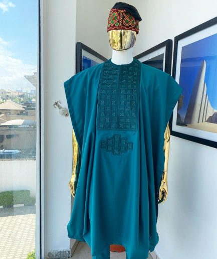 An emerald green, connected square embroidery design with matching green and red Swarovski stone details agbada