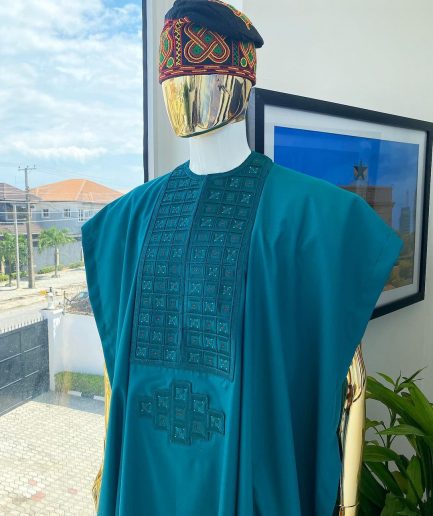 An emerald green, connected square embroidery design with matching green and red Swarovski stone details agbada