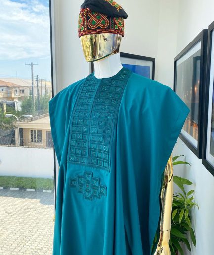 An emerald green, connected square embroidery design with matching green and red Swarovski stone details agbada
