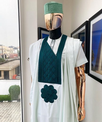 A pistachio green, connected inverted square ping green embroidery design agbada
