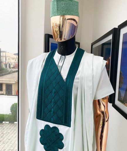 A pistachio green, connected inverted square ping green embroidery design agbada