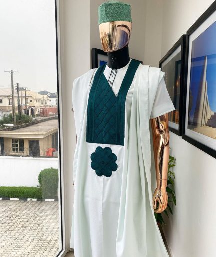 A pistachio green, connected inverted square ping green embroidery design agbada