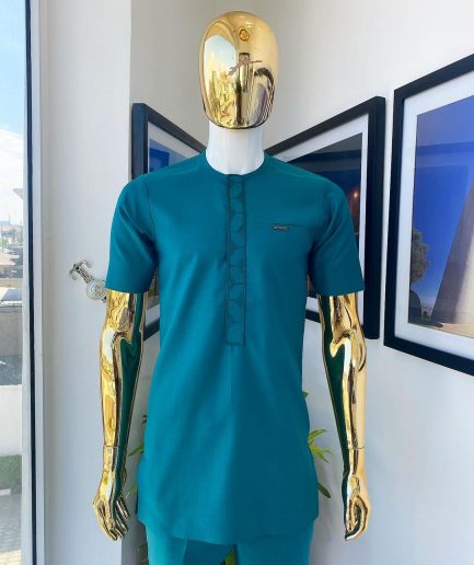An emerald green embroidery detailing African traditional senator kaftan native
