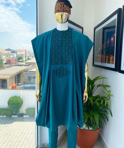 An emerald green, connected square embroidery design with matching green and red Swarovski stone details agbada