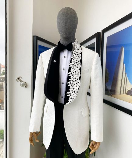 An Ivory white shawl lapel floral jacquard, satin taped lapel with floral details suit