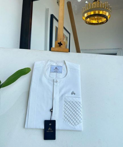 An Ivory White, clear view silver Swarovski buttons, ruffle pocket details, African traditional senator kaftan native.