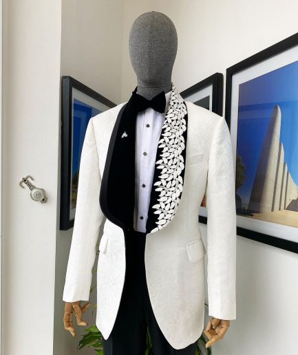 An Ivory white shawl lapel floral jacquard, satin taped lapel with floral details suit