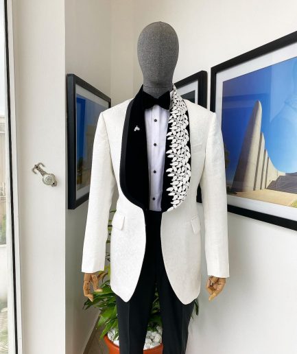 An Ivory white shawl lapel floral jacquard, satin taped lapel with floral details suit
