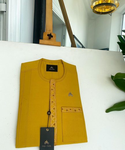 A Yellow, embroidery front flap, and patch pocket detail African traditional senator Kaftan native.
