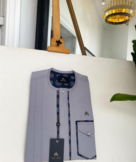 A Cloud Grey, clear view transparent Swarovski buttons, front flap, edge paisley cut pocket details African traditional senator kaftan native.