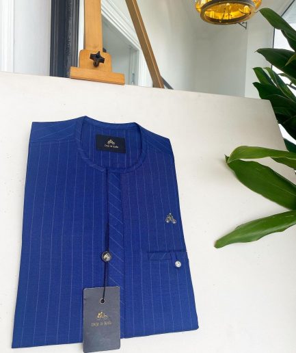 An Azure blue with Lapis blue stripe, Swarovski Button, strap shaped inner pocket details African traditional senator kaftan native.