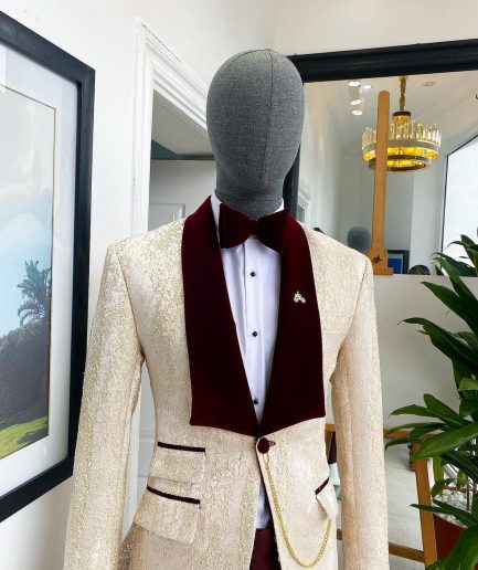 A “Mandarin” dispersed gold ruffle pattern burgundy shawl lapel jacquard suit