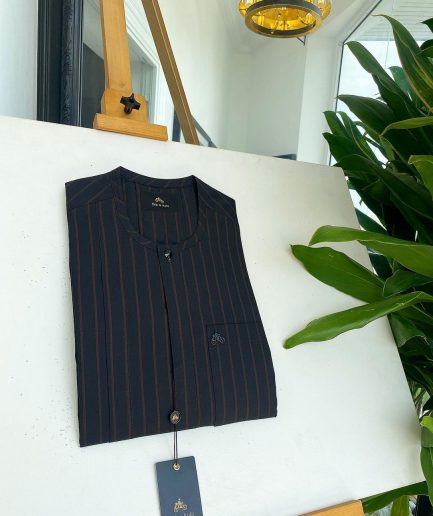 A black and plum bold stripe, black clear view Swarovski buttons, and front flap detail African traditional senator kaftan native