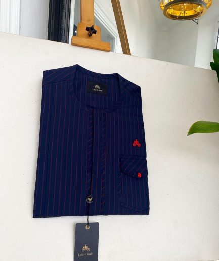 A Midnight Blue and Tomato red Pencil stripe, clear view red Swarovski buttons, front flap, patch pocket details African traditional senator kaftan native.