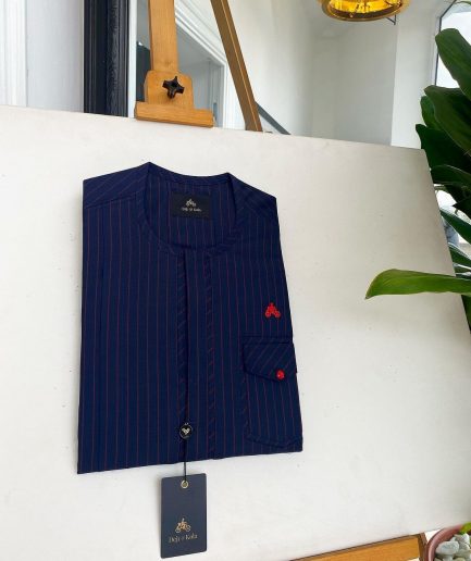 A Midnight Blue and Tomato red Pencil stripe, clear view red Swarovski buttons, front flap, patch pocket details African traditional senator kaftan native.