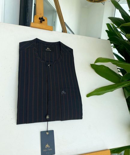 A black and plum bold stripe, black clear view Swarovski buttons, and front flap detail African traditional senator kaftan native