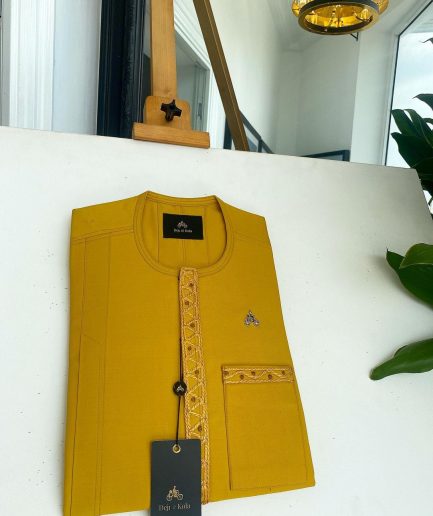 A Yellow, embroidery front flap, and patch pocket detail African traditional senator Kaftan native.
