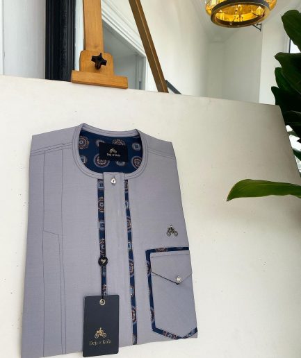 A Cloud Grey, clear view transparent Swarovski buttons, front flap, edge paisley cut pocket details African traditional senator kaftan native.