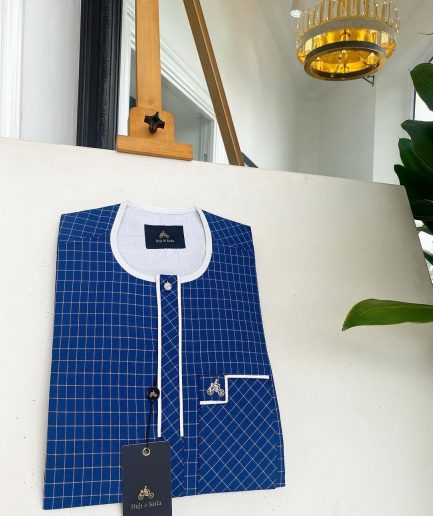 An ivory white and blue check, clear view transparent Swarovski buttons, front flap details African traditional senator kaftan native.