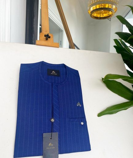 An Azure blue with Lapis blue stripe, Swarovski Button, strap shaped inner pocket details African traditional senator kaftan native.