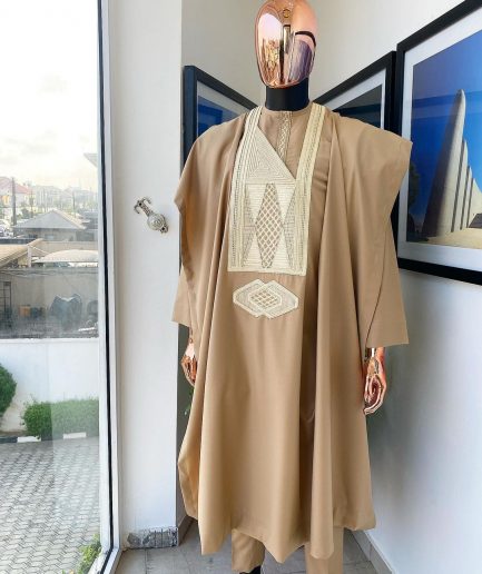 A Tortilla Brown, interconnected embroidery details agbada, buba and sokoto