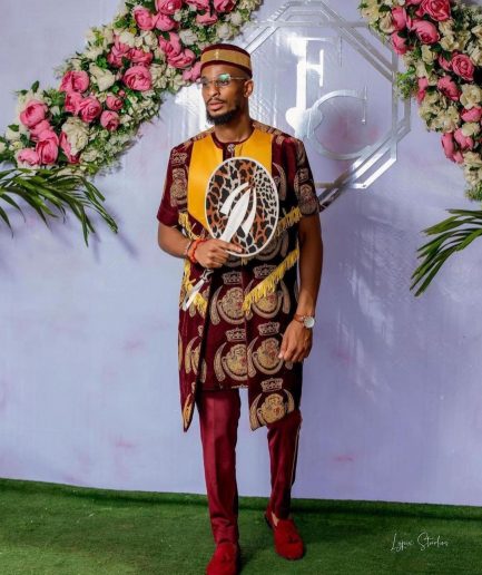 A burgundy Reloaded “isiagu” African traditional Wear with pant trouser
