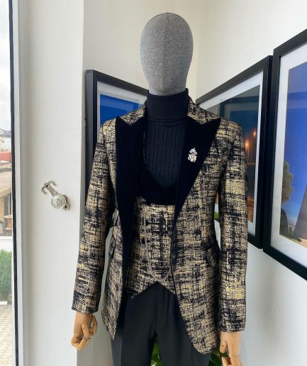 A “Mandarin” Dispersed Black And Gold Peak Lapel Suit.