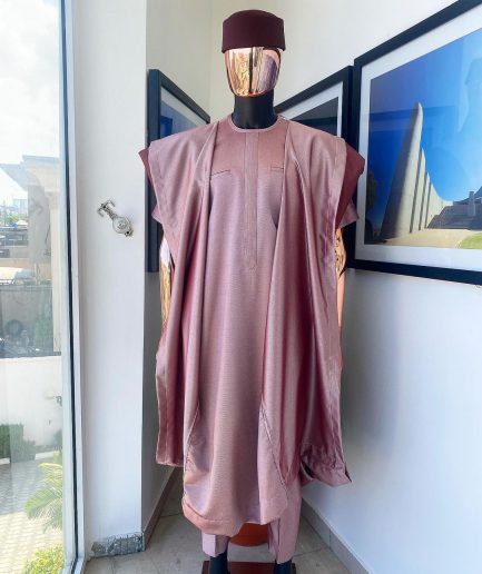 A classic light burgundy “kagbada”, Senator kaftan, burgundy round hat And sokoto