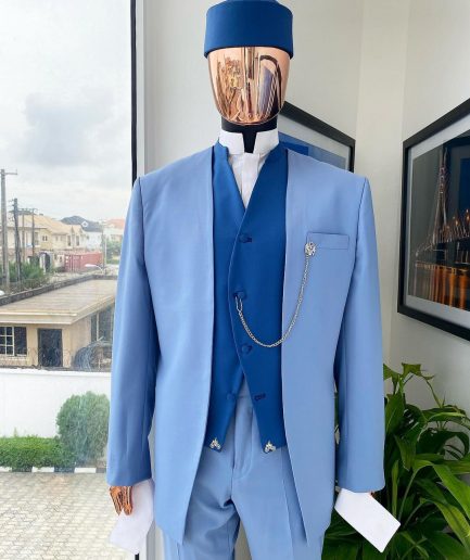 A reloaded ceremonial “Ayeye” Ijade 20/21 - Look 5- “Tokunbo” look. Powder blue half section back slant cut jacket