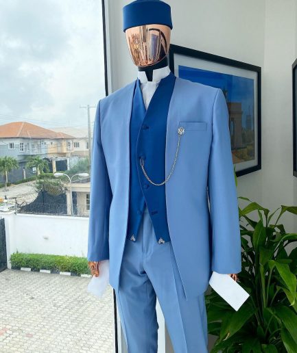 A reloaded ceremonial “Ayeye” Ijade 20/21 - Look 5- “Tokunbo” look. Powder blue half section back slant cut jacket