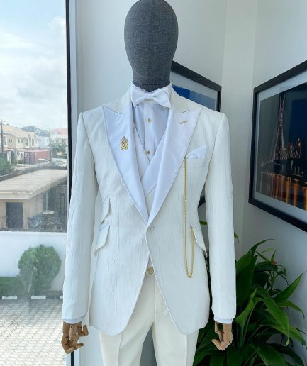 An Ivory white tear drop pattern jacquard hand picked peak lapel Suit.