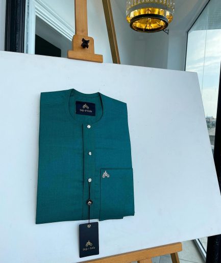A Hunter green, flap with Swarovski button details, African traditional senator Kaftan native