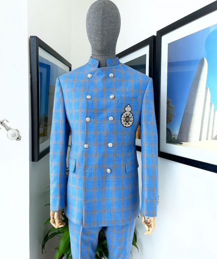 An Azure blue and apricot orange glen check “preacher” double breasted safari suit