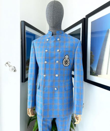 An Azure blue and apricot orange glen check “preacher” double breasted safari suit