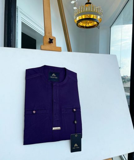 An eggplant purple, front flap and a 2 combat pocket African traditional senator kaftan native.
