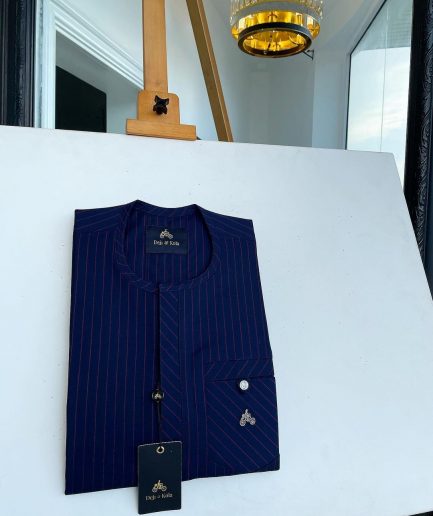 A pencil stripe midnight blue and red front flap with an inverse combat pocket Swarovski button details African traditional senator Kaftan native