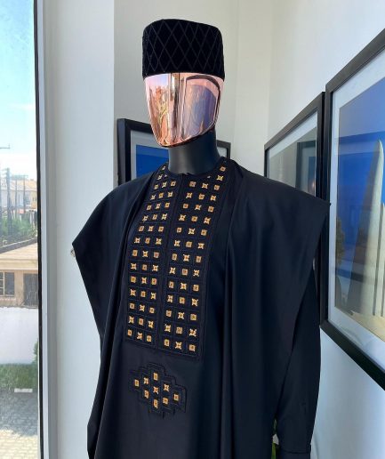 A charcoal black, connected square embroidery design with matching gold and red Swarovski stone details agbada