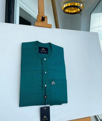 A Hunter green, flap with Swarovski button details, African traditional senator Kaftan native